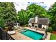 Charming pool house with an outdoor fireplace, providing a cozy space for relaxation and recreation at 171 Beverly Ne Rd, Atlanta, GA 30309