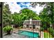 Charming pool house with an outdoor fireplace, providing a cozy space for relaxation and recreation at 171 Beverly Ne Rd, Atlanta, GA 30309