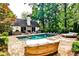 Private backyard retreat with a luxurious pool, spa, and stylish outdoor seating areas at 171 Beverly Ne Rd, Atlanta, GA 30309