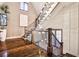 Beautiful staircase with hardwood floors, iron railings and stylish pendant lighting at 171 Beverly Ne Rd, Atlanta, GA 30309