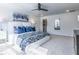 Bright bedroom with plush carpeting, stylish decor, and a contemporary ceiling fan and wall art at 1735 Fulmont Cir, Mableton, GA 30126