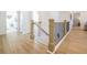 Upstairs hallway with railing, and an open view into other rooms, creating a connected and inviting home environment at 1735 Fulmont Cir, Mableton, GA 30126