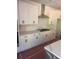 Elegant kitchen with white cabinets, stainless steel appliances, and light countertops at 1735 Fulmont Cir, Mableton, GA 30126