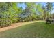 This is an expansive backyard with a patio and lush greenery, ideal for outdoor activities and relaxation at 1905 Buford Ct, Conyers, GA 30094