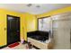 Bathroom with a black soaking tub, a shower, and bright yellow walls at 1905 Buford Ct, Conyers, GA 30094