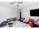 Bedroom with a ceiling fan, a window, carpeted floor and a TV at 1905 Buford Ct, Conyers, GA 30094