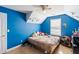 Blue bedroom featuring a ceiling fan, a window, and carpeted floor at 1905 Buford Ct, Conyers, GA 30094