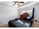 Cozy bedroom featuring a ceiling fan, tray ceiling, and natural light at 1905 Buford Ct, Conyers, GA 30094