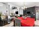 Dining area with a black accent wall, a dining table, and an adjacent living area with a fireplace at 1905 Buford Ct, Conyers, GA 30094