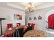 Inviting dining room with chandelier, decorative wall accents, and elegant furnishings at 1905 Buford Ct, Conyers, GA 30094