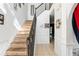 Bright foyer with staircase, tile flooring, and decorative wall accents at 1905 Buford Ct, Conyers, GA 30094