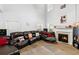 Cozy living room with a fireplace, large sectional sofa, and high ceilings for an open feel at 1905 Buford Ct, Conyers, GA 30094