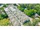 Aerial view of a residential community surrounded by lush greenery and a community pool at 4046 Hazel Nut Ln, Atlanta, GA 30342