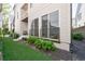 Backyard featuring artificial turf, modern patio and stylish railing with adjacent home exterior at 4046 Hazel Nut Ln, Atlanta, GA 30342