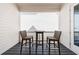 Cozy covered balcony with bar-height seating and a modern design, ideal for enjoying the outdoors at 4046 Hazel Nut Ln, Atlanta, GA 30342