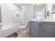 Bathroom boasts a shower-over-tub with subway tile and a modern vanity at 4046 Hazel Nut Ln, Atlanta, GA 30342