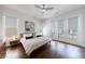 Bright bedroom with hardwood floors, ceiling fan, and access to an outdoor balcony at 4046 Hazel Nut Ln, Atlanta, GA 30342