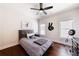 Bedroom featuring a ceiling fan, hardwood floors, two large windows and neutral walls at 4046 Hazel Nut Ln, Atlanta, GA 30342