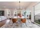Modern dining room featuring a large oval table, stylish chairs, and an elegant light fixture at 4046 Hazel Nut Ln, Atlanta, GA 30342