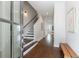 Bright entryway with hardwood floors, staircase with dark treads, and tasteful decor leading into the home at 4046 Hazel Nut Ln, Atlanta, GA 30342