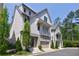 A modern two-story home boasting white siding, a gray foundation, and a conveniently attached one car garage at 4046 Hazel Nut Ln, Atlanta, GA 30342