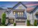 Charming two-story home with a balcony, attached garage and a well-manicured front yard at 4046 Hazel Nut Ln, Atlanta, GA 30342