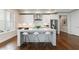 Modern kitchen featuring a large island with seating and stainless steel appliances for culinary enthusiasts at 4046 Hazel Nut Ln, Atlanta, GA 30342