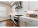 Well-equipped kitchen with stainless steel range and sleek countertops, perfect for cooking and entertaining guests at 4046 Hazel Nut Ln, Atlanta, GA 30342