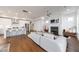 Spacious open-concept design with an inviting fireplace, stylish kitchen, and hardwood floors throughout at 4046 Hazel Nut Ln, Atlanta, GA 30342
