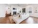 Inviting living room with a fireplace, modern sectional sofa, and hardwood floors for a cozy atmosphere at 4046 Hazel Nut Ln, Atlanta, GA 30342