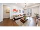 Bright living room featuring hardwood floors, modern decor, and access to the outside at 4046 Hazel Nut Ln, Atlanta, GA 30342