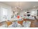 Open layout with living, dining, and kitchen areas featuring hardwood floors and lots of natural light at 4046 Hazel Nut Ln, Atlanta, GA 30342