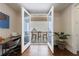 An office nook leads to a private patio with outdoor seating through glass doors at 4046 Hazel Nut Ln, Atlanta, GA 30342