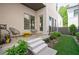 Inviting patio area with modern seating, neat landscaping, and artificial turf, perfect for outdoor relaxation at 4046 Hazel Nut Ln, Atlanta, GA 30342