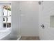 Glass shower with white subway tile, gray shower floor, chrome fixtures, and a window at 4046 Hazel Nut Ln, Atlanta, GA 30342