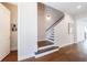 Staircase featuring hardwood steps and railing, connecting different levels of the home at 4046 Hazel Nut Ln, Atlanta, GA 30342