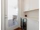 Charming wet bar with bar fridge and access to the exterior patio at 4046 Hazel Nut Ln, Atlanta, GA 30342
