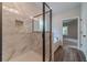 Modern bathroom featuring a glass shower, marble tile, and a soaking tub at 1482 Alcovy Station Rd, Covington, GA 30014
