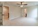 Spacious bedroom with plush carpeting and a doorway leading to another room at 1482 Alcovy Station Rd, Covington, GA 30014