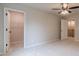 Spacious bedroom features plush carpeting and access to the walk-in closet at 1482 Alcovy Station Rd, Covington, GA 30014