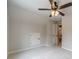 Neutral bedroom featuring plush carpet and a ceiling fan at 1482 Alcovy Station Rd, Covington, GA 30014