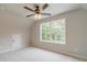 Bright bedroom with a large window and plush carpeting at 1482 Alcovy Station Rd, Covington, GA 30014