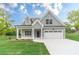 Charming exterior of a two-story home featuring a manicured lawn and welcoming curb appeal at 1482 Alcovy Station Rd, Covington, GA 30014