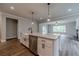 Kitchen island featuring stainless appliances, granite countertops and open floor plan at 1482 Alcovy Station Rd, Covington, GA 30014