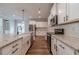Modern kitchen with granite countertops, stainless steel appliances, and white cabinets offering plenty of storage at 1482 Alcovy Station Rd, Covington, GA 30014