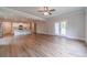 Open floor plan living room and kitchen with hardwood floors and glass doors to patio at 1482 Alcovy Station Rd, Covington, GA 30014