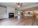 Open floor plan view of living room, fireplace, and modern kitchen with island seating at 1482 Alcovy Station Rd, Covington, GA 30014