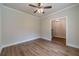 Spacious living room featuring hardwood floors, white trim, neutral walls, and ceiling fan at 1482 Alcovy Station Rd, Covington, GA 30014