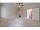 Light-filled bedroom with backyard view and bathroom and closet doors at 1482 Alcovy Station Rd, Covington, GA 30014