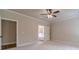 Spacious bedroom with a view of the bathroom through an open door at 1482 Alcovy Station Rd, Covington, GA 30014